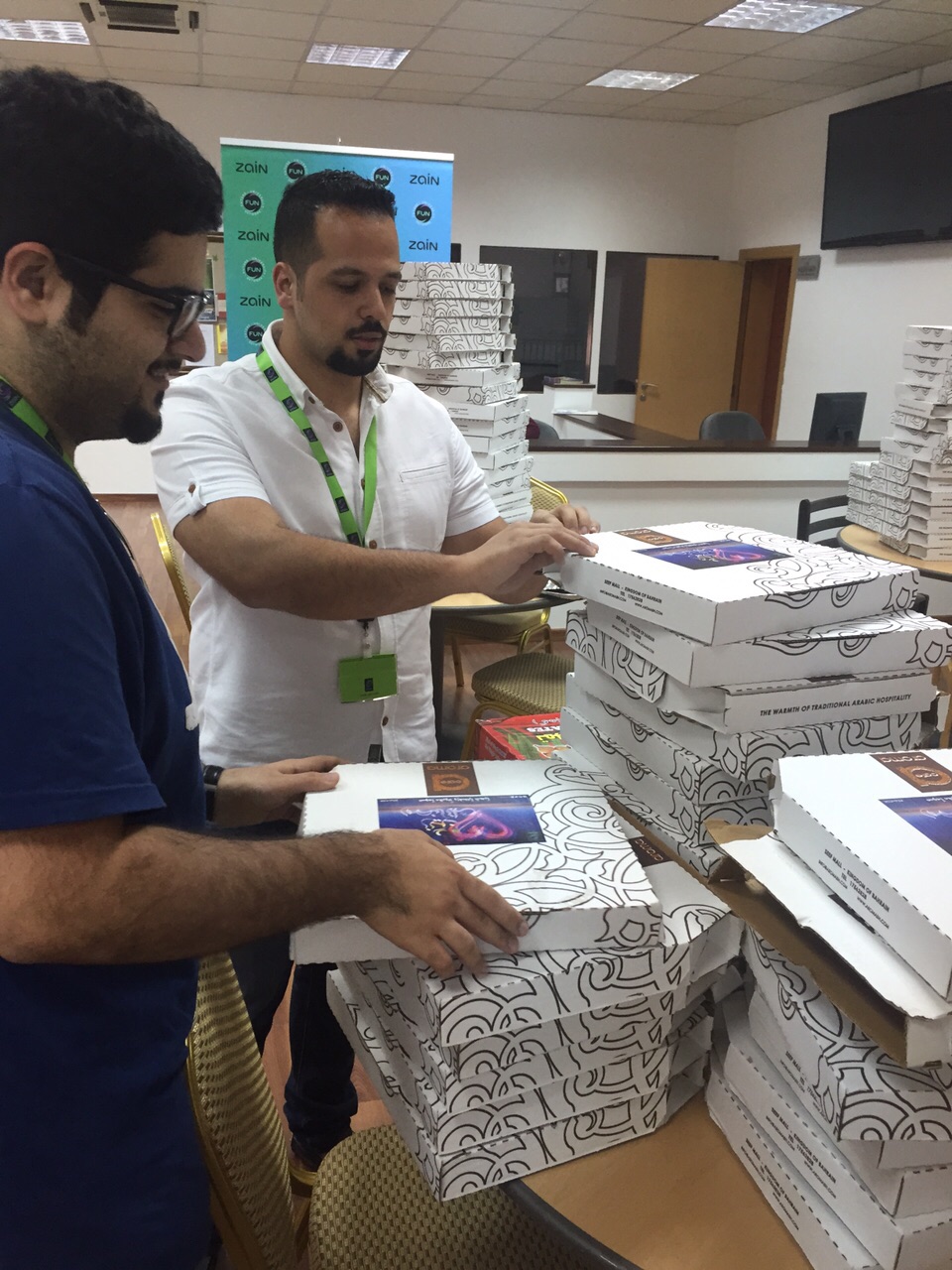 Zain Bahrain Staff Distributing Food during Ramadhan.jpg